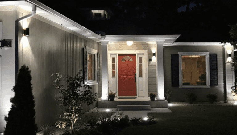 Modern outdoor lighting fixtures installed around a home's exterior, highlighting the importance of upgrading outdoor lighting.